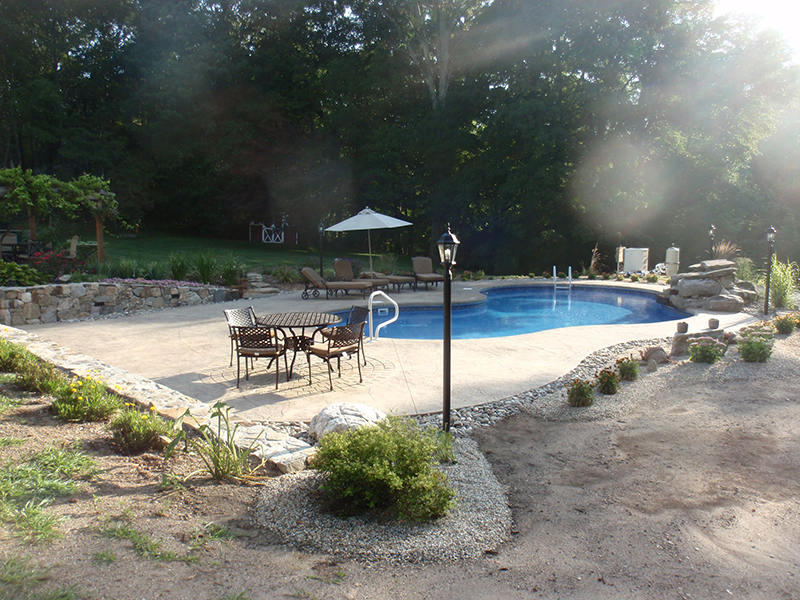 Swimming pool and stamped concrete project example 29